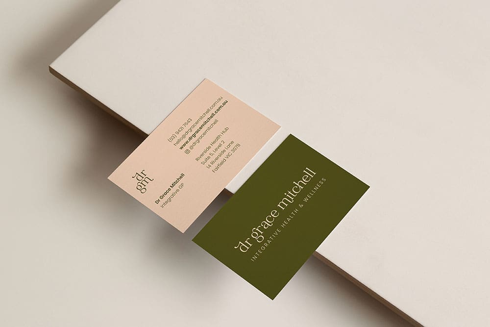 Professional branding details including quality business cards and typography creating a consistent brand experience.